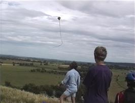 Ryan and Lee watch some kite-flying on Burrow Mump, 11.2 miles into the ride